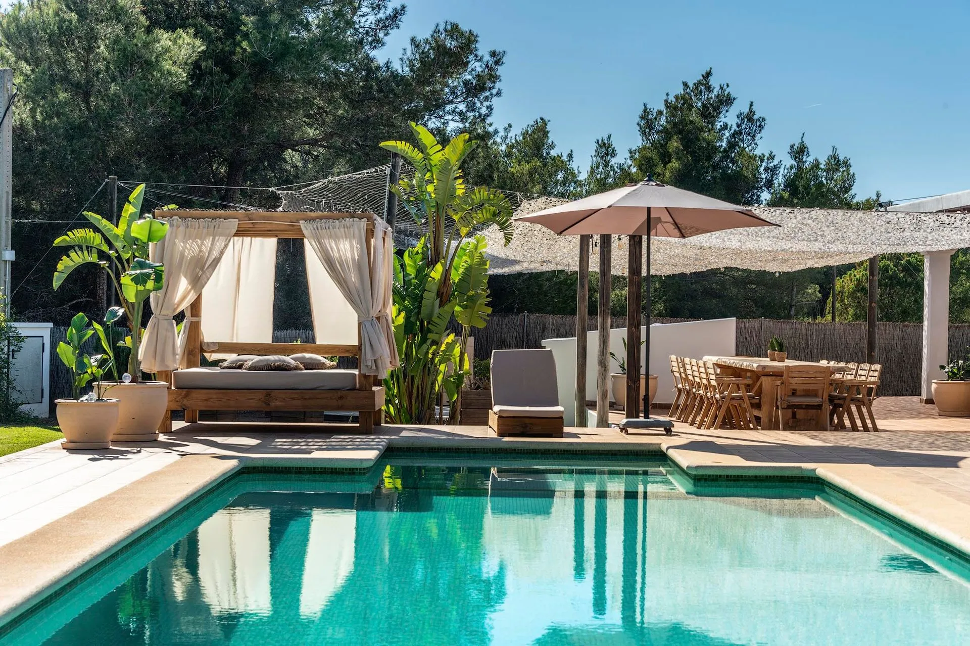 Original listing photograph showing the same pool, cabana and terrace as the reel